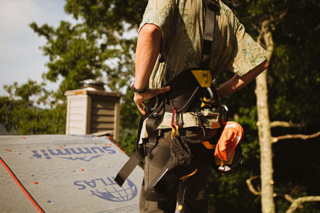 A roofer at work on an American home